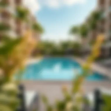 Refreshing Community Pool at Nasma Residences Community pool area at Nasma Residences surrounded by lush greenery