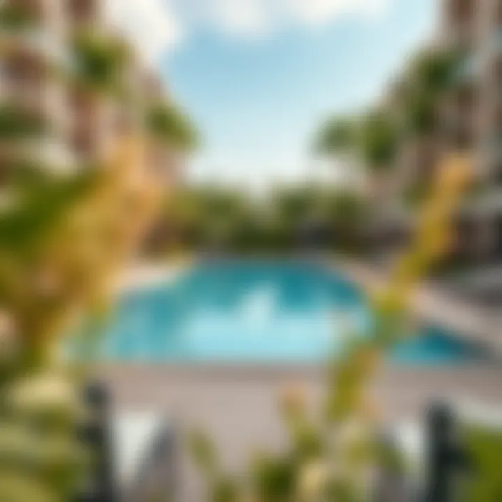 Refreshing Community Pool at Nasma Residences Community pool area at Nasma Residences surrounded by lush greenery