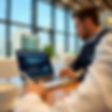 Agent Using Damac Portal Real estate agent utilizing the Damac Agents Portal on a laptop